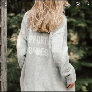 Babes supporting Babes cardigan
